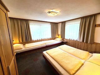 Bedroom with double bed and 2 single beds NEW