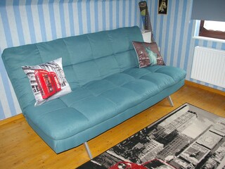 Ferienhaus Mitteldeich Spielzimmer mit Schlafcouch