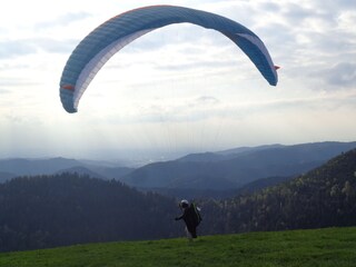 On approach, paragliders in the air