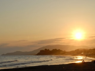 Beach Castiglione at the sunset