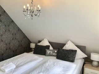 Beautiful bedroom with great box spring bed