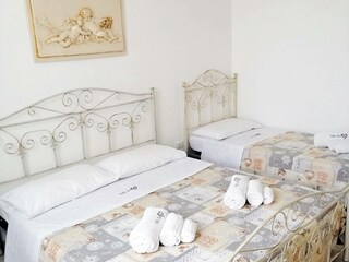 Bedroom with double and single bed