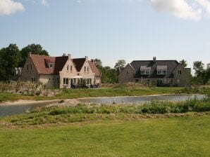 Ferienpark Spaziosa villa con camino decorativo a Texel